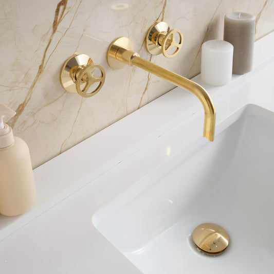 Timeless Brass Bathtub Faucet by Brasska Design featuring handcrafted unlacquered brass finish with wall-mounted spout and dual cross handles.