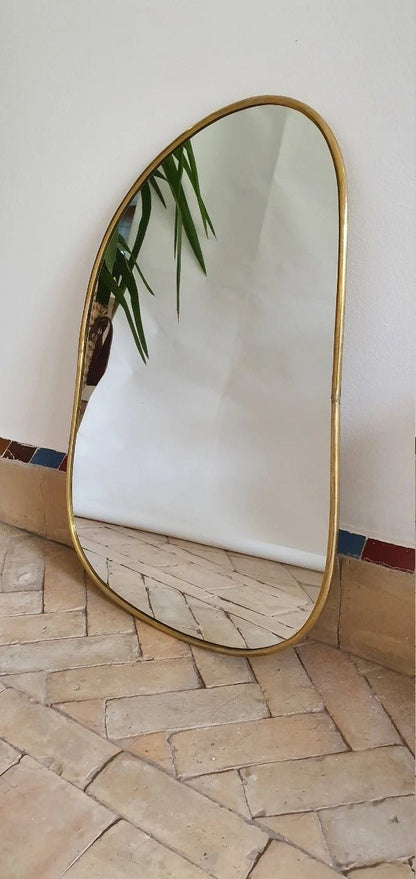 Asymmetrical Brass Framed Wall Mirror with a modern brass finish, ideal for stylish wall decor in living rooms or bedrooms.