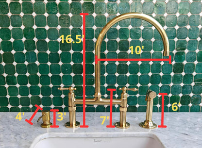 Bridge kitchen faucet with side sprayer in unlacquered brass finish, featuring durable brass construction and modern design.