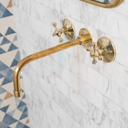 Elegant Vintage Brass Wall-Mounted Faucet with polished brass finish, featuring classic design for bathroom or kitchen installation.