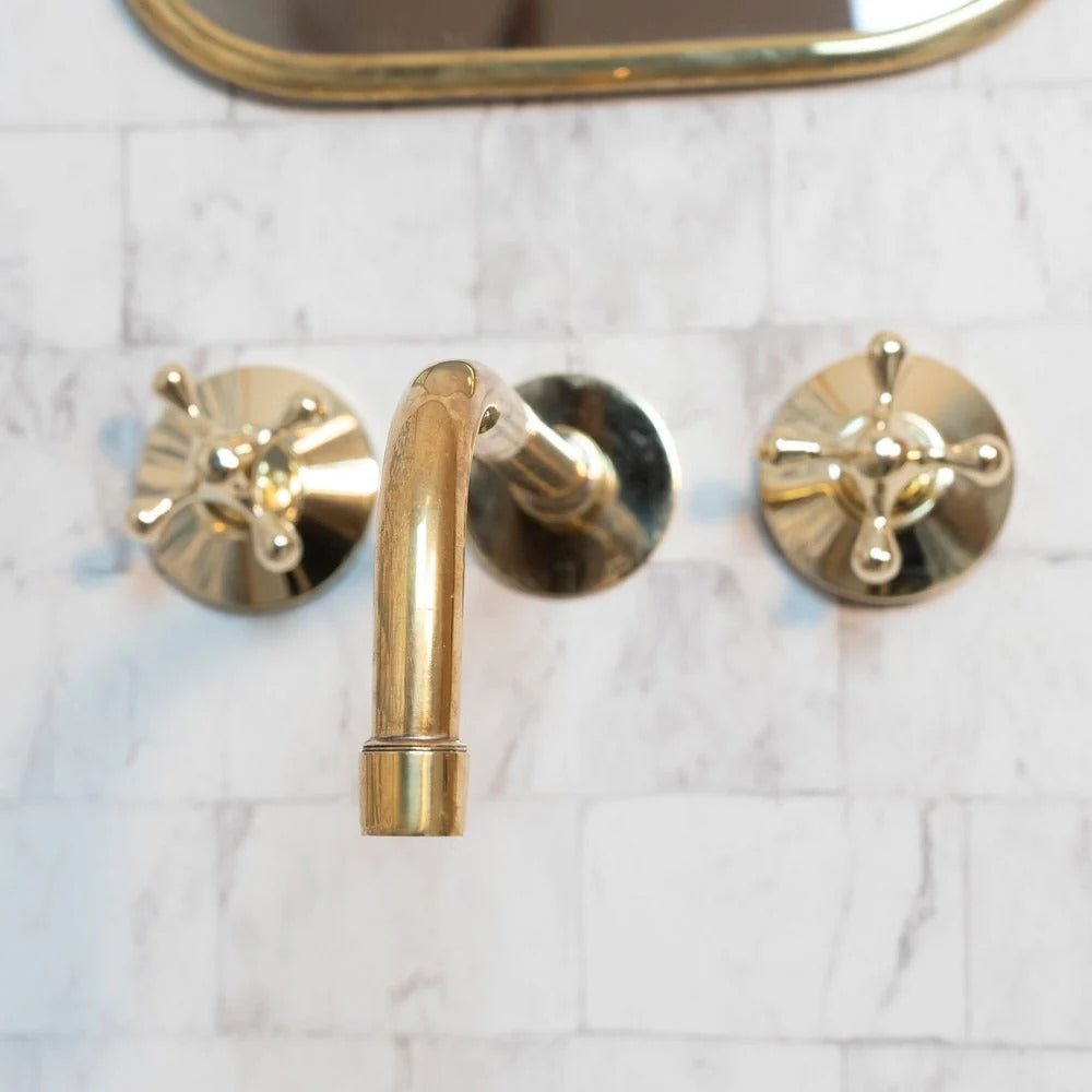 Elegant Vintage Brass Wall-Mounted Faucet with polished brass finish, suitable for classic bathroom or kitchen decor.