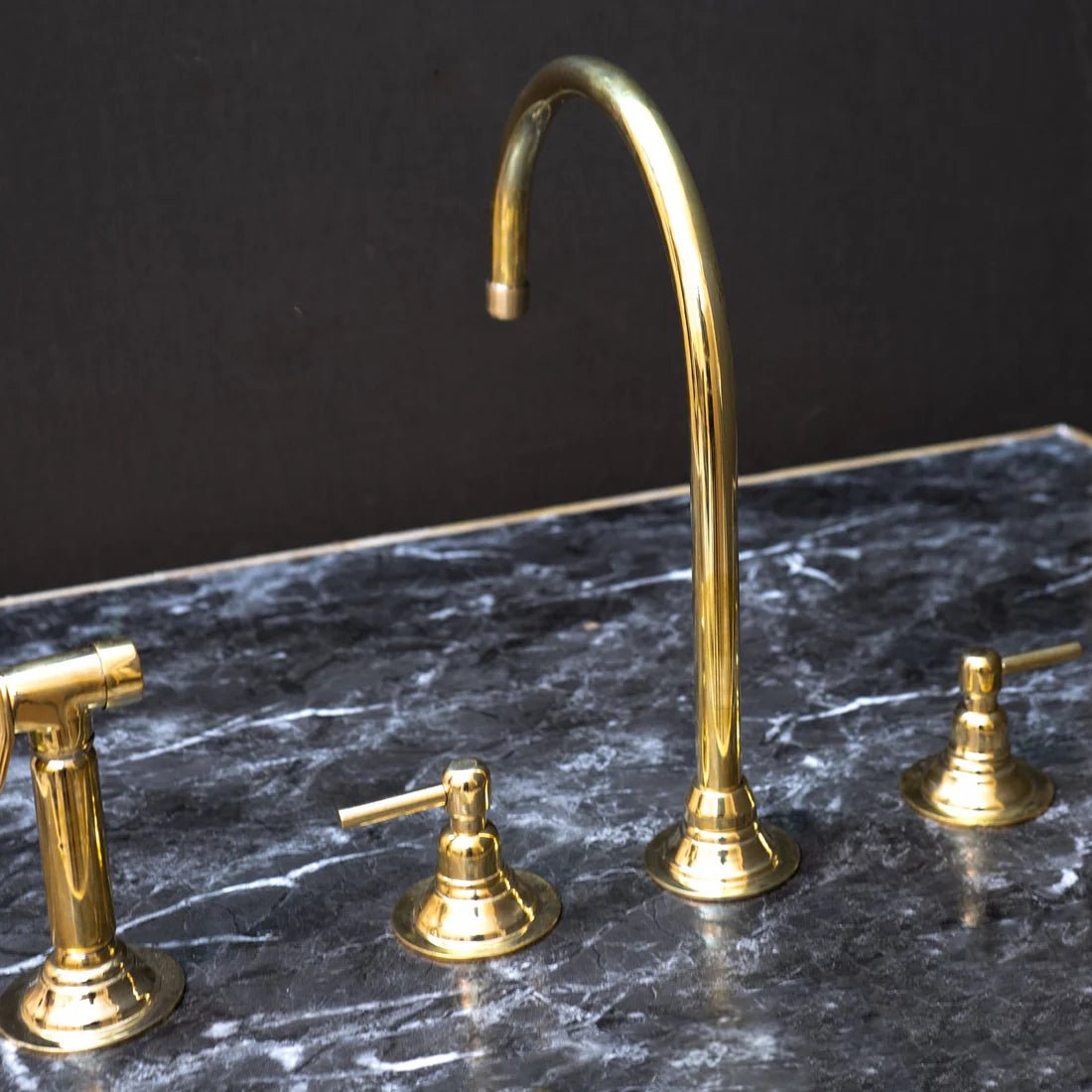 Unlacquered Brass Gooseneck Deck Mounted Kitchen Faucet with curved spout and single handle for traditional kitchen use