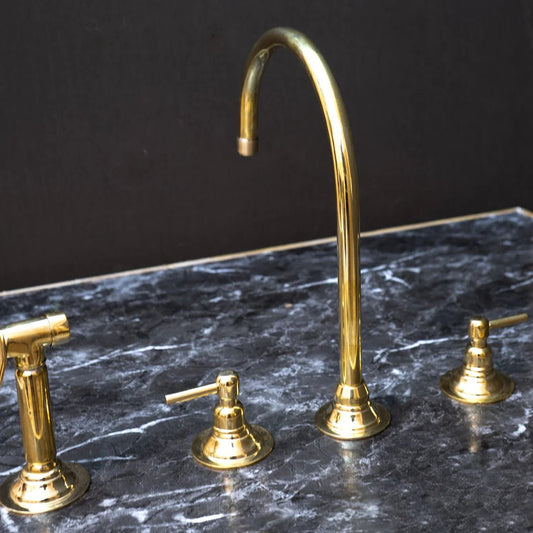 Unlacquered Brass Gooseneck Deck Mounted Kitchen Faucet with curved spout and single handle for traditional kitchen use