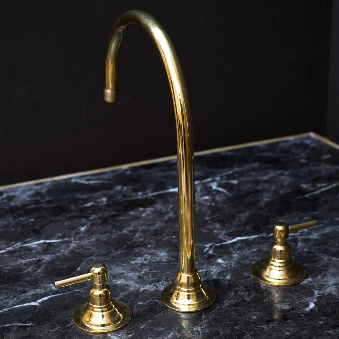 Unlacquered Brass Gooseneck Deck Mounted Kitchen Faucet with curved spout and single handle for modern kitchen use