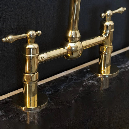 Victorian Bridge Kitchen Faucet with Side Sprayer in unlacquered brass, featuring vintage design and durable metal construction.