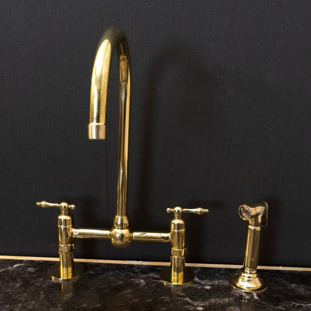 Victorian Bridge Kitchen Faucet with Side Sprayer in Unlacquered Brass, featuring a vintage design and durable brass construction.
