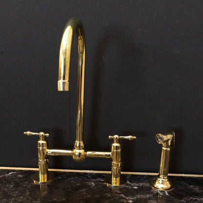 Victorian Bridge Kitchen Faucet with Side Sprayer in Unlacquered Brass, featuring a vintage design and durable brass construction.